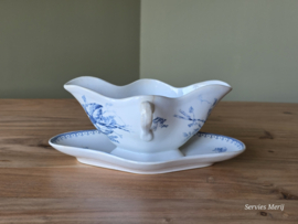 Meibloem Petrus Regout sauskom op onderschotel (rond model)