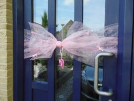 Roze deurstrik geboorte meisje