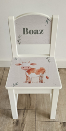 Stoeltje met naam en Koe