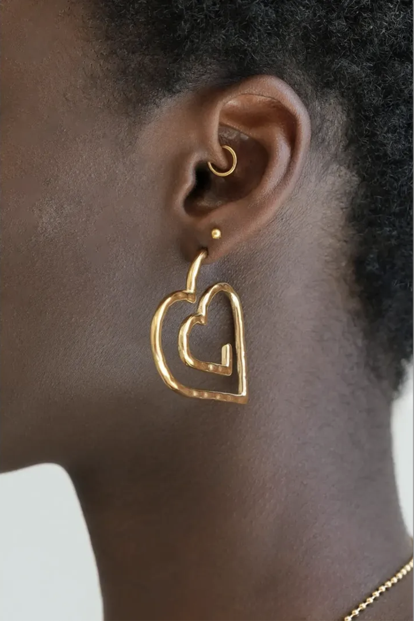 Nomads oorhangers met hartjes swirl - Goud