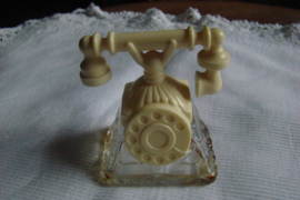 Vintage parfumflesje van Avon telefoon zeventiger jaren.