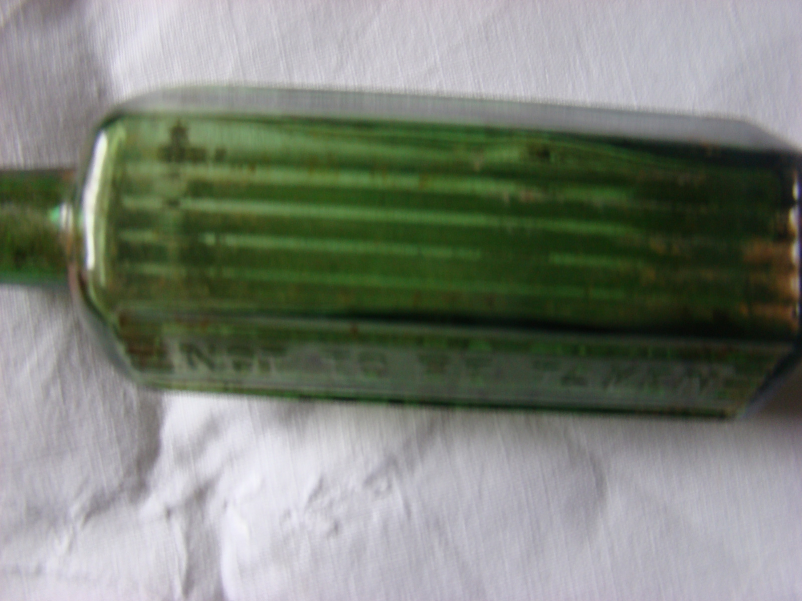 Groen glazen medicijnflesje