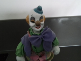Beweegbare clown met speeldoos.