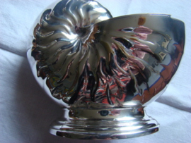 Lepelverwarmer of spoon warmer.