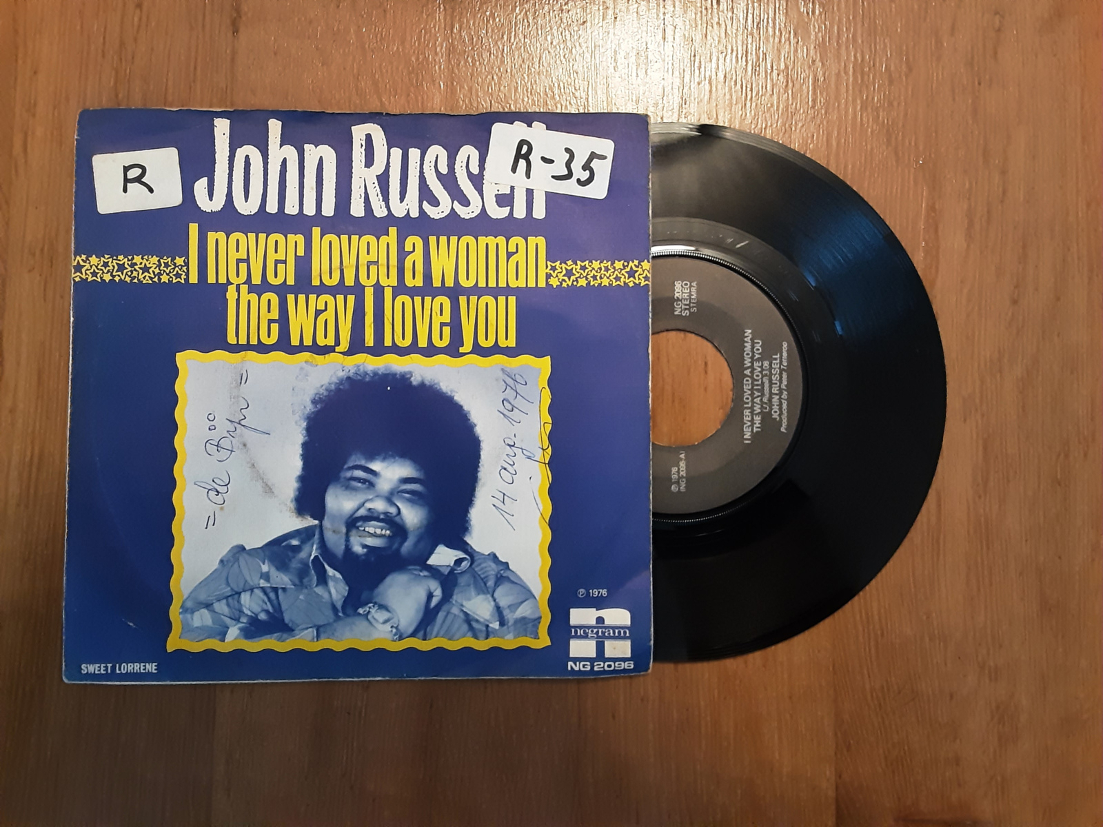 John Russel met I never loved a woman the way I love you 1976 Single nr S20234445