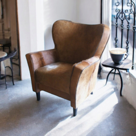 Mickey oorfauteuil in bruin koeienhuid