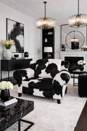 Bommel , loveseat in zwartwit koeienhuid