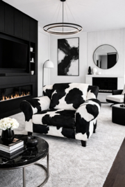 Bommel , loveseat in zwartwit koeienhuid
