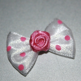 Roze polkadot strikje met roos 1 stuks