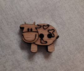 Houten knoop in de vorm van een koe