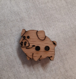 Houten knoop in de vorm van een varken