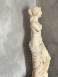 French antique statue on marble foot