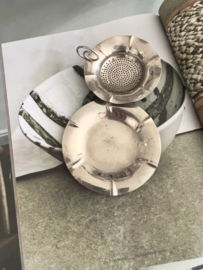 Old tea strainer with plate