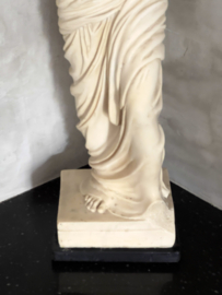 French antique statue on marble foot