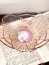 Pink glass dish on small feet