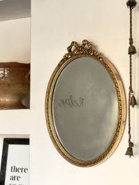 Oval Rococo mirror with bow
