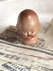 Tiny old dolls head