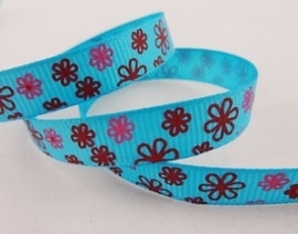 Blauw met roze rode bloemen.  per meter