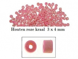 Roze houten kraal 75 voor €1,00