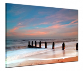 Foto schilderij palen strand