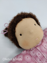 Soft doll pink with brown hair