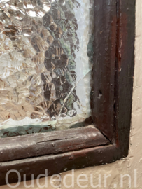 nr. 4703 oude opgeklampte glas deur