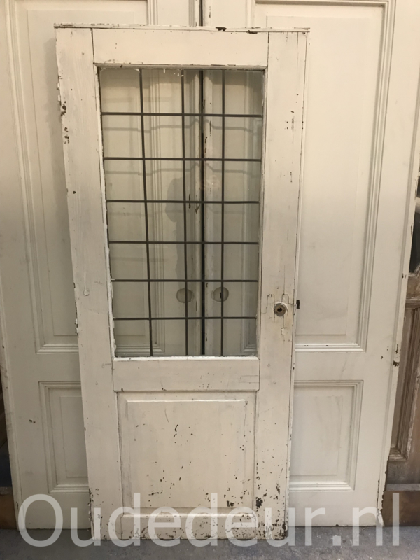 nr. gl341 oude deur met opgeplakt lood