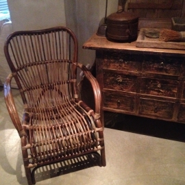 Vintage rotan rieten stoel fauteuil landelijk industrieel stoer jaren '70 retro rieten lounge urban tuinstoel