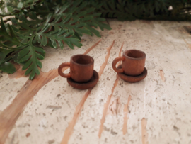 brown cup and saucer