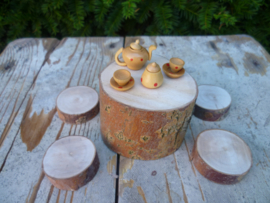 Wooden table with four stools