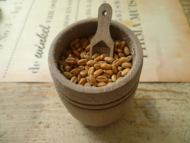 Barrel of weathered wood with scoop