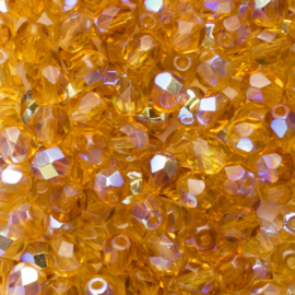 10 x  Tsjechische kralen facet kristal  6 x 4 mm  kleur: ab goudgeel Afm: Gat c.a: 1mm