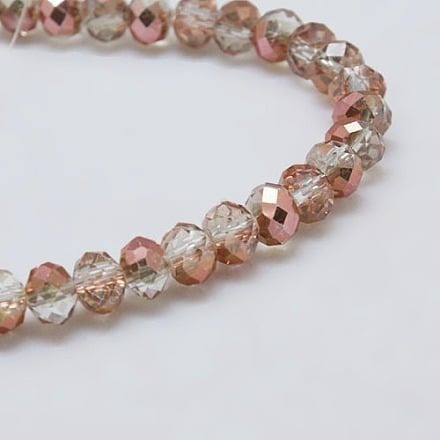 1 x Streng met ca. 68 Glaskralen Facet Rondelle Briolette Kristal – 8 x 6 mm – gat 1 mm – Half Copper Plated Clear