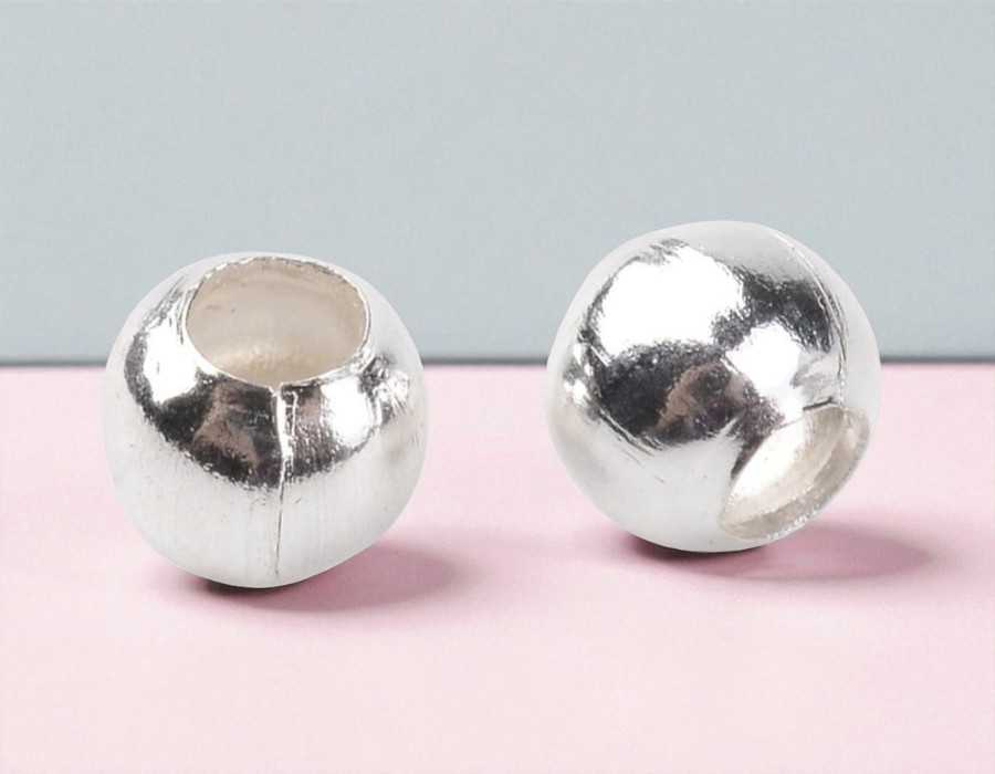 100 x Metalen kraaltjes zilverkleur 2 mm – gat ca. 0,3 mm