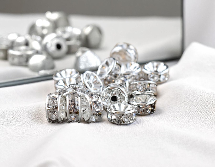 50 x Verzilverde Kristal Rondellen 6 x 3mm clear gat 1,5mm