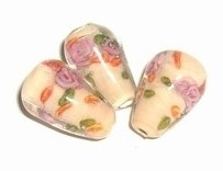 10 x Glaskraal bolle druppel 12x9mm transparant met peach kleurige kern en roze bloemen