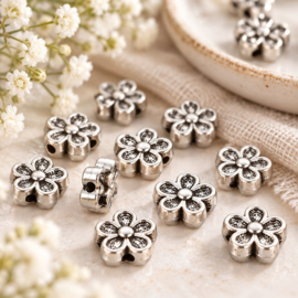 10 x Metalen bloem kralen 3D 7 x 3,5 mm – gat 1 mm – antiek zilverkleur 