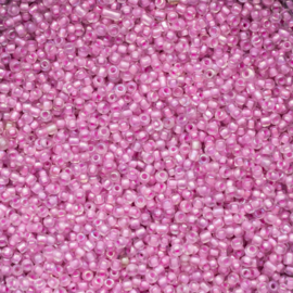 Per 20 gram Rocailles 12/0  oud roze transparant Luminous inside