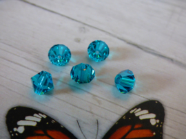 10 x Preciosa Kristal Bicone 6mm  gat: 1mm Kleur hemels blauw