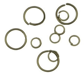 C.a. 100 x geel koperen gemengde ringetjes van 4mm t/m 12mm 0,7mm dik