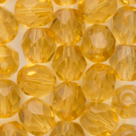 10 x Tsjechische kralen facet kristal 6 x 5mm kleur: goud geel Afm: Gat c.a: 1mm