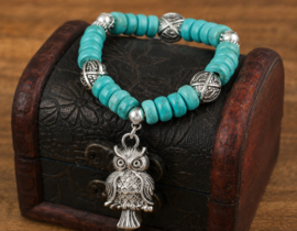 1 x Turquoise kleur kralen armband op elastiek met uil bedel – antiek zilverkleur