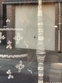 Schelpentoren met statue ( beschermer voor het huis )