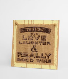 Wooden sign This home runs on love | 