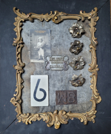 Zwart met gouden lijst