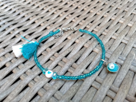 Blauw enkelbandje met schelpje, katoenen kwastjes en hartkraaltje