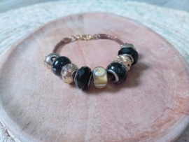 Zwart met gouden pandora style armband