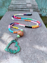 Lange Bohemian ketting met turquoise harthanger