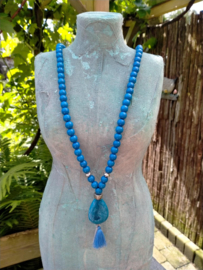 Lange blauw/zilverkleur ketting van acryl en metallook  kralen