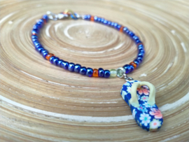 Donkerblauw en oranje enkelbandje met AB rocailles